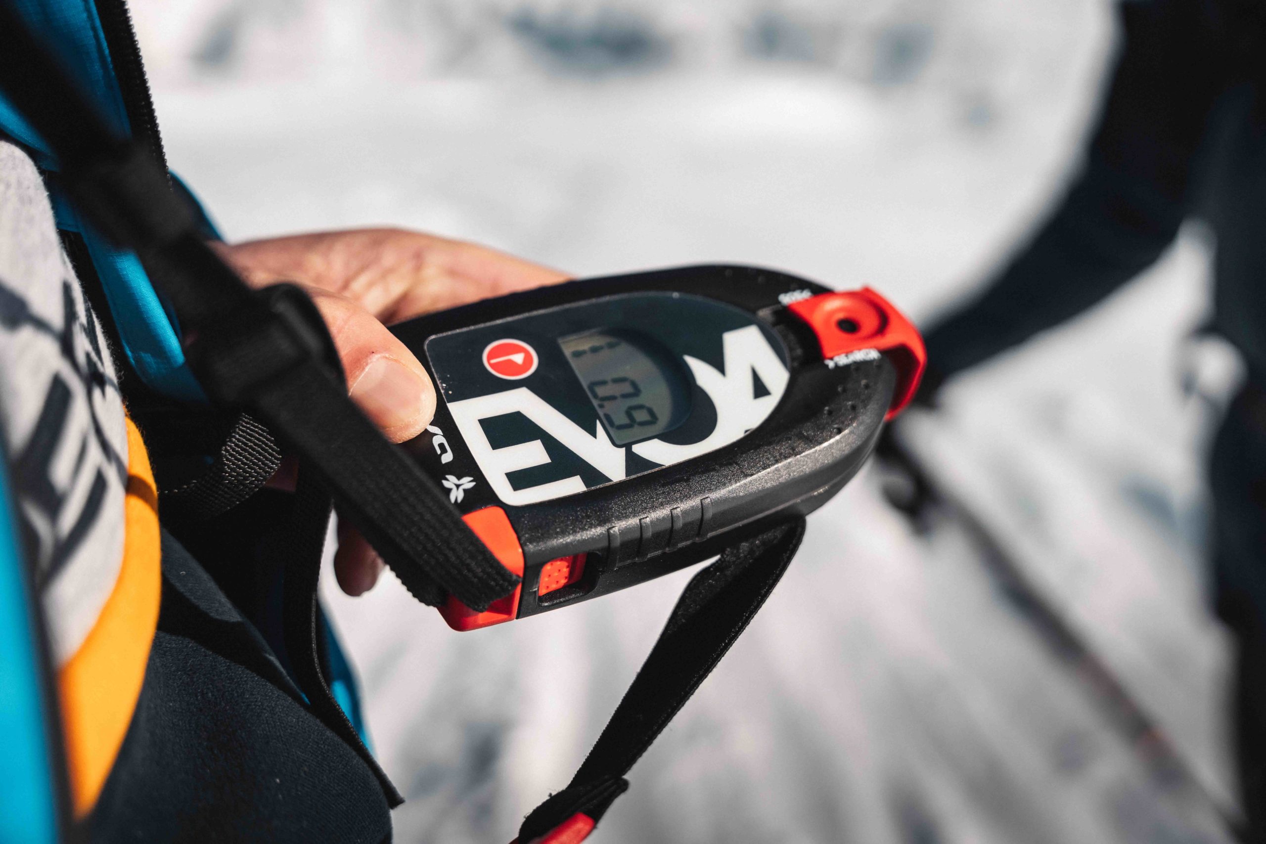 Close-up of an avalanche transceiver with a snow-covered background in Flaine.